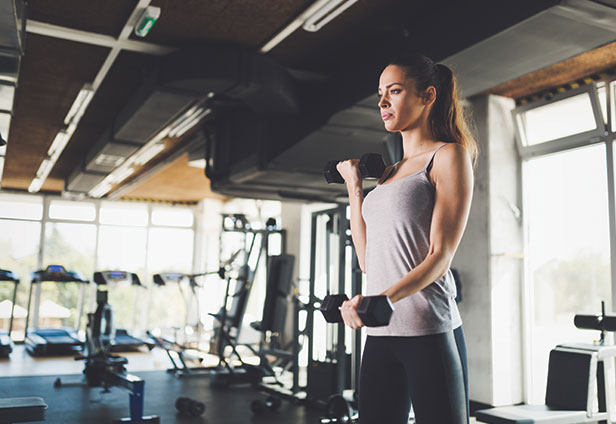 girl doing weight lifting